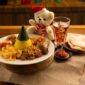Sepiring nasi kuning hangat dengan beragam lauk pauk seperti ayam goreng, telur iris, dan serundeng, siap memanjakan lidah para penikmat kuliner. Hidangan ikonik ini mencerminkan kekayaan budaya dan tradisi kuliner Indonesia yang tak lekang oleh waktu.