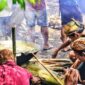 Seorang ahli pengobatan tradisional di Kutai sedang meracik bahan-bahan alami dari hutan, menunjukkan dedikasi dalam melestarikan warisan leluhur. Gambar ini menggambarkan kekayaan alam Kalimantan yang menjadi sumber utama ramuan herbal berkhasiat.