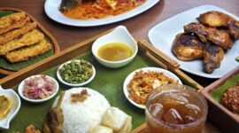 Sajian nasi kuning berbentuk tumpeng yang dihiasi beragam lauk pauk khas Indonesia, memancarkan keindahan dan kekayaan kuliner Nusantara yang siap dinikmati. Hidangan ini seringkali menjadi pusat perhatian dalam berbagai perayaan dan syukuran.